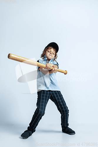 Image of Pretty young boy in casual clothes on white studio background