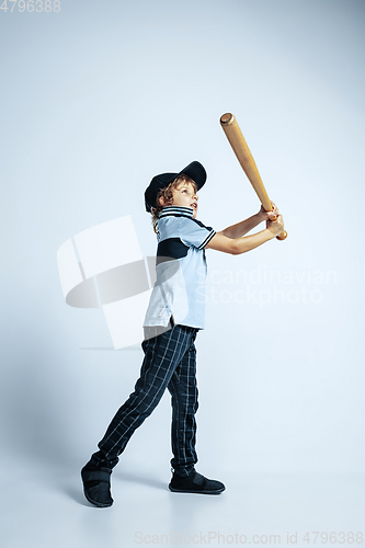 Image of Pretty young boy in casual clothes on white studio background