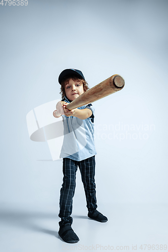 Image of Pretty young boy in casual clothes on white studio background