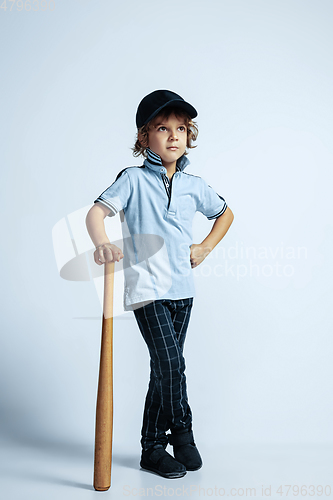 Image of Pretty young boy in casual clothes on white studio background