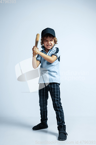 Image of Pretty young boy in casual clothes on white studio background