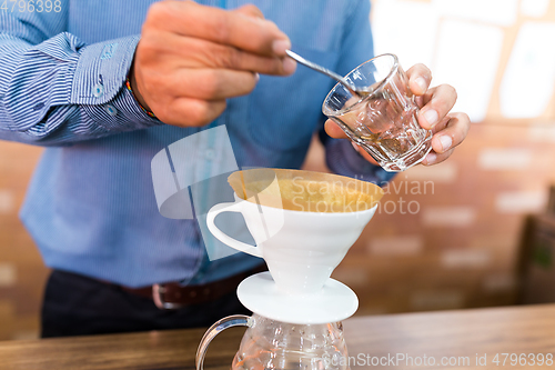 Image of Barista making of hand drip coffee in cafe