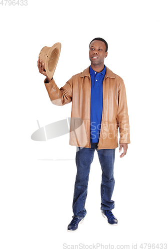 Image of Handsome man standing in brown leather jacket