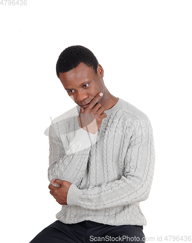 Image of Close up of African man sitting and thinking