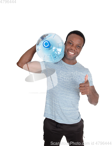 Image of Handsome African man carrying water bottle