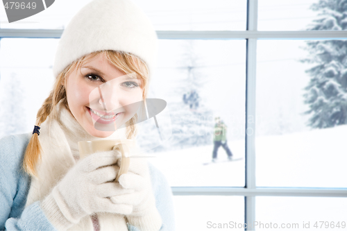 Image of Caucasian girl drinking coffee