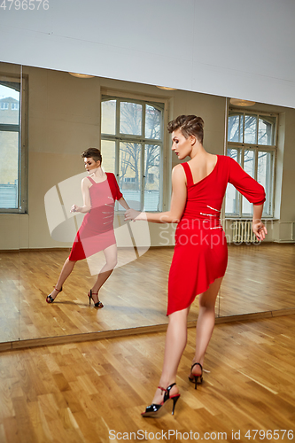 Image of tango dancer woman excersizing in dance studio room