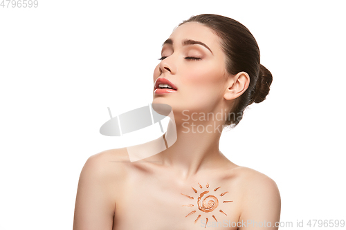 Image of girl with sun drawing on forehead isolated on white