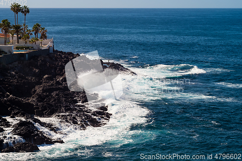 Image of beautiful view on blue ocean water and rocky coast line