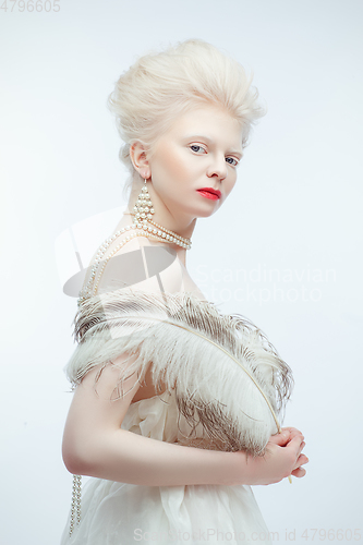 Image of beautiful albino girl with red lips on white background