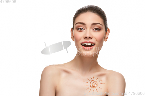 Image of girl with sun drawing on forehead isolated on white