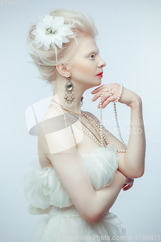 Image of beautiful albino girl with red lips on white background