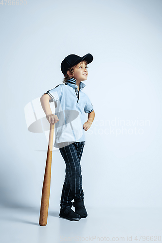 Image of Pretty young boy in casual clothes on white studio background