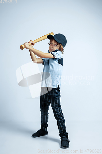 Image of Pretty young boy in casual clothes on white studio background