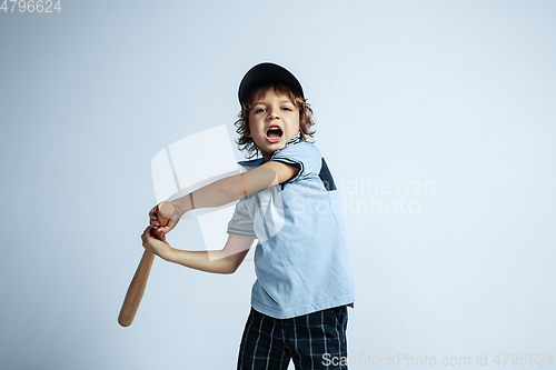 Image of Pretty young boy in casual clothes on white studio background