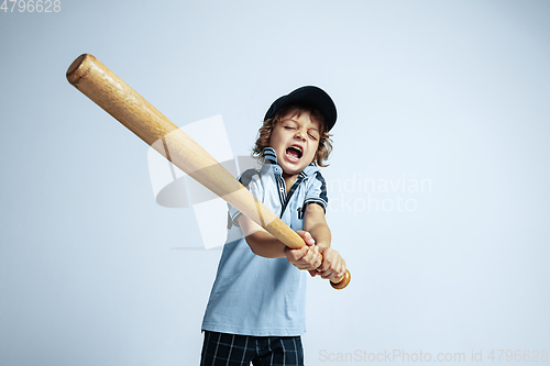 Image of Pretty young boy in casual clothes on white studio background