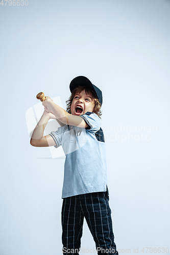 Image of Pretty young boy in casual clothes on white studio background