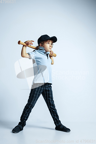 Image of Pretty young boy in casual clothes on white studio background