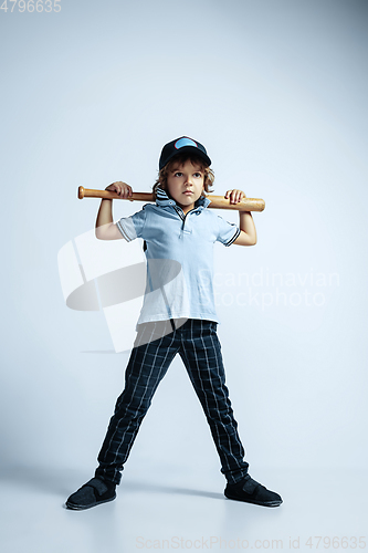 Image of Pretty young boy in casual clothes on white studio background