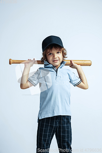 Image of Pretty young boy in casual clothes on white studio background