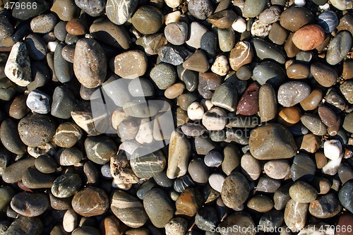 Image of wet pebbles in waves of the Black Sea