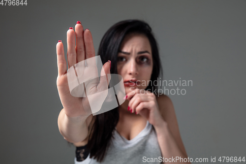 Image of Woman in fear of domestic abuse and violence, concept of female rights