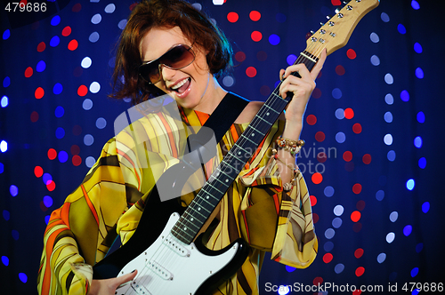 Image of Female guitar player