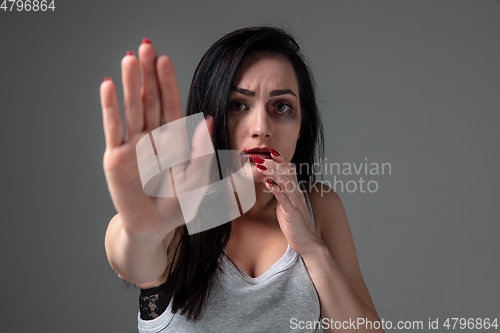 Image of Woman in fear of domestic abuse and violence, concept of female rights