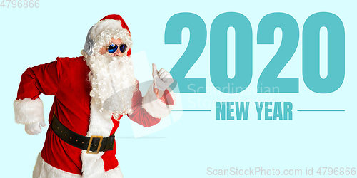 Image of Santa Claus isolated on blue studio background