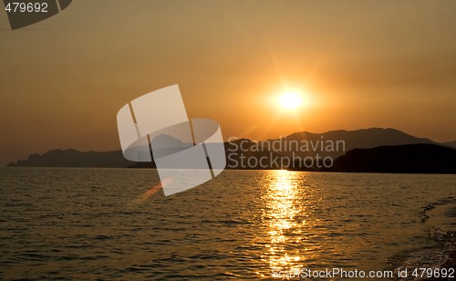 Image of Sunset over the sea and mountains. Ukraine. Southern coast of Cr