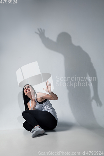 Image of Woman being under domestic abuse and violence, concept of female rights