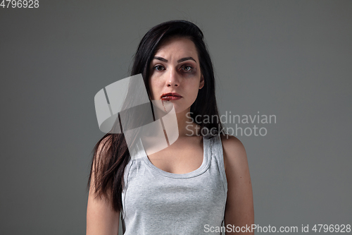 Image of Woman in fear of domestic abuse and violence, concept of female rights