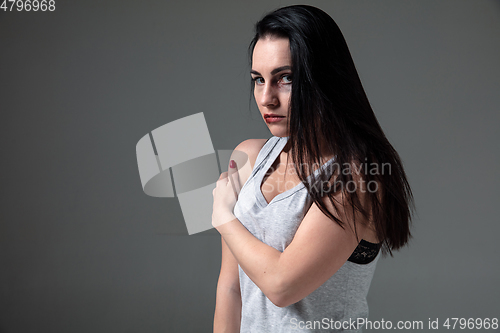 Image of Woman in fear of domestic abuse and violence, concept of female rights