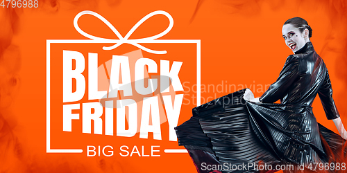 Image of Woman as a vampire in black dress on fire background, black friday