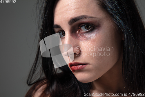 Image of Woman in fear of domestic abuse and violence, concept of female rights