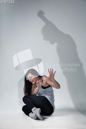 Image of Woman being under domestic abuse and violence, concept of female rights