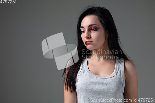 Image of Woman in fear of domestic abuse and violence, concept of female rights