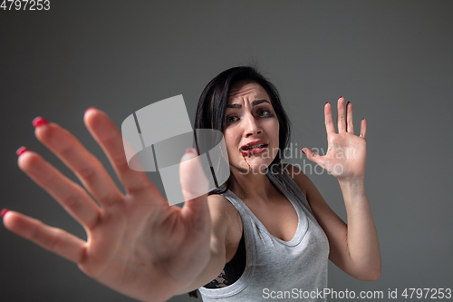 Image of Woman in fear of domestic abuse and violence, concept of female rights