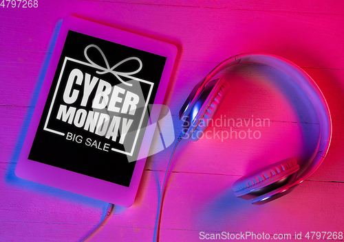 Image of Top view of set of gadgets in purple neon light