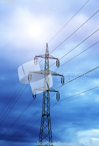 Image of High voltage tower against the evening cloudy sky