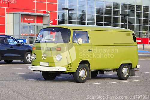 Image of Green Volkswagen Camper Van Parked