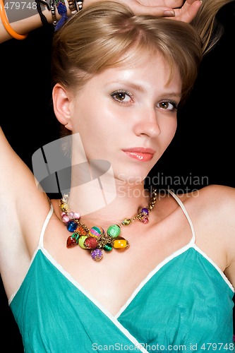 Image of Portrait of the young beauty woman. Isolated on black