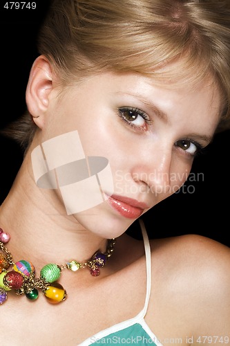 Image of Portrait of the young beauty blonde. Isolated on black