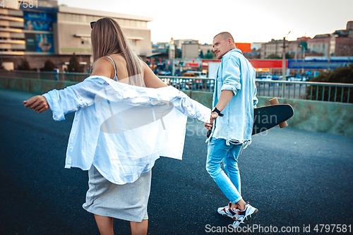 Image of Tanned young caucasian couple, modern lovestory in film grain effect