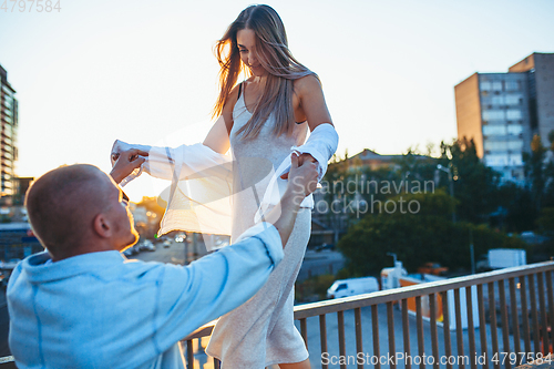 Image of Tanned young caucasian couple, modern lovestory in film grain effect