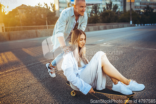 Image of Tanned young caucasian couple, modern lovestory in film grain effect