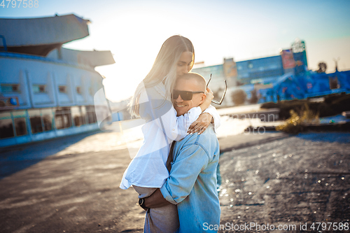 Image of Tanned young caucasian couple, modern lovestory in film grain effect