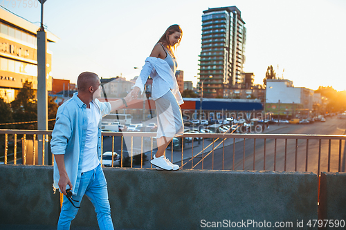 Image of Tanned young caucasian couple, modern lovestory in film grain effect