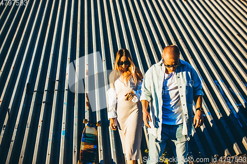 Image of Tanned young caucasian couple, modern lovestory in film grain effect