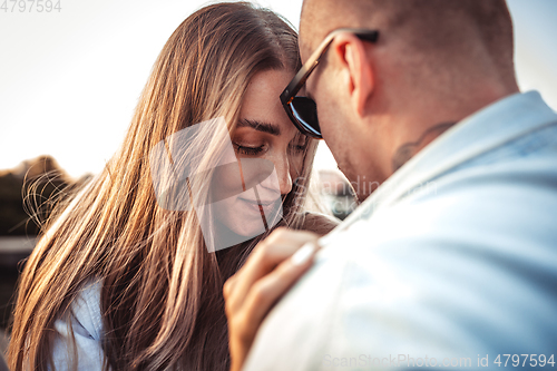 Image of Tanned young caucasian couple, modern lovestory in film grain effect